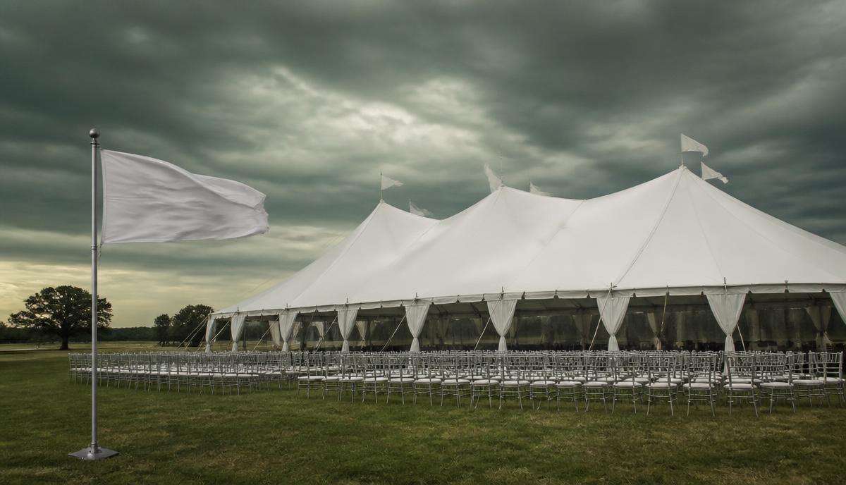 Tornado Warning During Outdoor Festival — Annual company festival, 5,000 employees + families, outdoor park venue with permanent buildings nearby